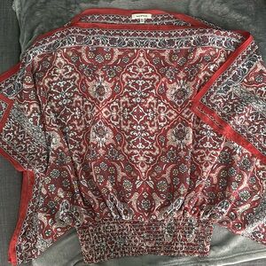 Max Studio rayon red with floral and paisley designs.